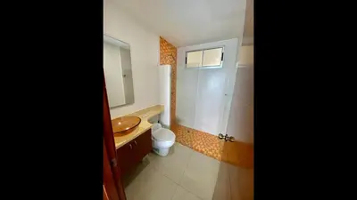a bathroom with a sink and a toilet and a mirror at 2 Bedroom Beachfront Apartment 2P1-Al2 With Pool And WIFI in Cartagena de Indias