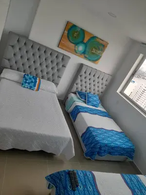 a model of a bedroom with two beds and a window at 2 Bedroom Beachfront Apartment in Cartagena de Indias
