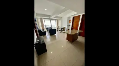 a room with a desk and chairs in a building at 2 Bedroom Beachfront Apartment in Cartagena de Indias