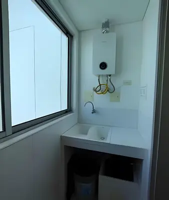 a bathroom with a sink and a window at Laurdhomes Palmetto Beach Floor 32, Sea View, 3HBT in Cartagena de Indias