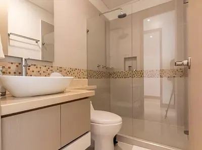 a bathroom with a sink and a toilet and a shower at Laurdhomes Palmetto Beach Floor 32, Sea View, 3HBT in Cartagena de Indias
