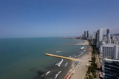 a view of a beach with buildings and the ocean at Laurdhomes Palmetto Beach Floor 32, Sea View, 3HBT in Cartagena de Indias