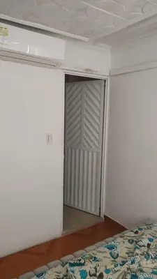 a bedroom with a closet and a bed in it at Apartamento Amoblado Cartagena in Cartagena de Indias