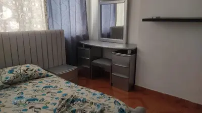a bedroom with a bed and a vanity with a mirror at Apartamento Amoblado Cartagena in Cartagena de Indias