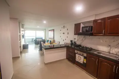 a kitchen with a sink and a stove top oven at 2B/2B Gorgeous Sunsets-Ocean View -Pool in Cartagena de Indias