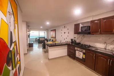 a kitchen with a sink and a stove top oven at 2B/2B Gorgeous Sunsets-Ocean View -Pool in Cartagena de Indias