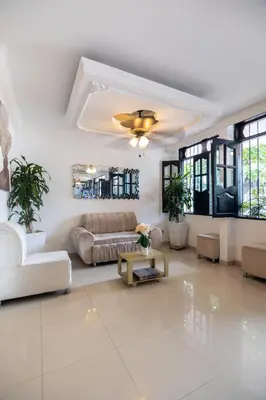 a living room with a couch and a table at Hotel Boutique Casa Pere in Cartagena de Indias