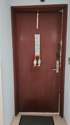 a brown door with a sign on it at Cartagena Apartamento 409 Edf Morros 922 ToLuSa in Cartagena de Indias
