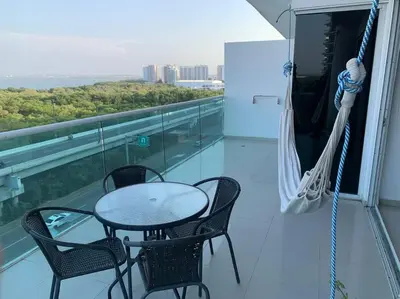 a patio with a table and chairs on a balcony at Apartamento Morros 922 in Cartagena de Indias