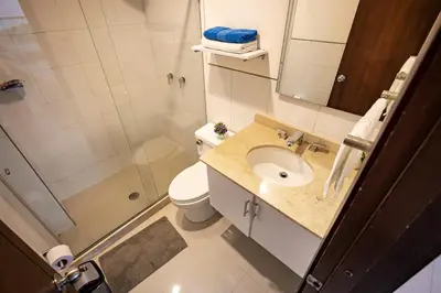 a bathroom with a toilet and a sink and a shower at Apartamento Morros 922 in Cartagena de Indias