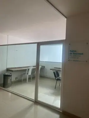 a room with a glass door with a table and chairs at DISFRUTE Y PLAYA in Cartagena de Indias