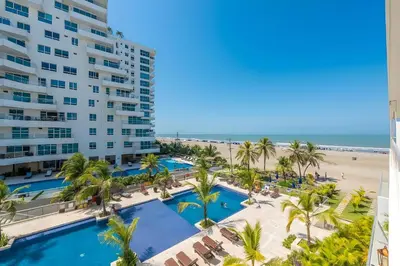 a view of the beach from the balcony of a resort at Condominio frente al mar con acceso directo a la playa Morros Epic. in Cartagena de Indias