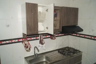 a kitchen with a sink and a stove at Apartamento el Calamar in Cartagena de Indias