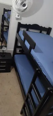 a bunk bed in a room with a fan at Apartamento el Calamar in Cartagena de Indias