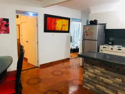 a kitchen with a stainless steel refrigerator and a stove at Casa ISABELLA - Playa dormida in Santa Marta