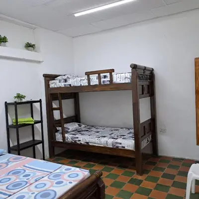 a room with two bunk beds in a room at Hostal Casa Lara in Cartagena de Indias
