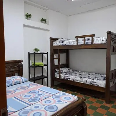 a room with two bunk beds in a room at Hostal Casa Lara in Cartagena de Indias