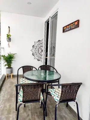 a glass table and chairs in a room at Apartamento morros con acceso directo a la playa in Cartagena de Indias