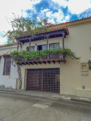 a building with a balcony with plants on it at Apartamento morros con acceso directo a la playa in Cartagena de Indias
