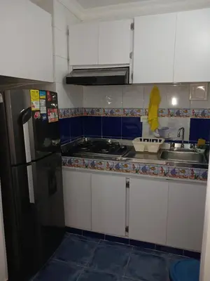a small kitchen with a sink and a refrigerator at Apartamento con hermosa vista al mar en cartagena de indias in Cartagena de Indias