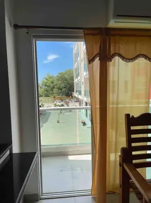 a sliding glass door with a view of a balcony at Apartamento en Coveñas cerca al mar #204 in Coveñas