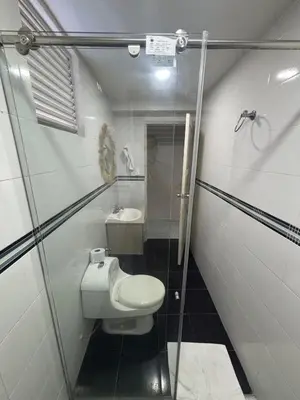 a small bathroom with a toilet and a sink at Wonderful trinity beach house in crespo. in Cartagena de Indias
