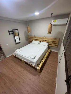 a bedroom with a large bed in a room at Wonderful trinity beach house in crespo. in Cartagena de Indias