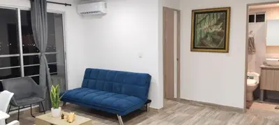 a blue couch in a room with a bathroom at Brisa de la Bahia in Cartagena de Indias
