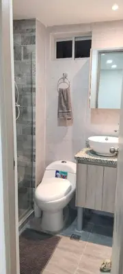 a bathroom with a toilet and a sink at Brisa de la Bahia in Cartagena de Indias