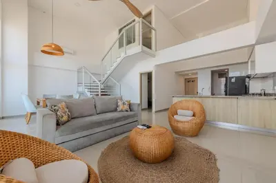 a living room with a gray couch and chairs at amor por cartagena in Cartagena de Indias