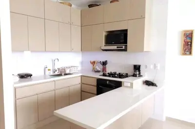 a white kitchen with a sink and a stove at * * Magnífico * * apto en la playa * *Costazul 405 in Santa Marta