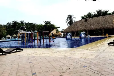 a swimming pool with a playground in a resort at * * Magnífico * * apto en la playa * *Costazul 405 in Santa Marta