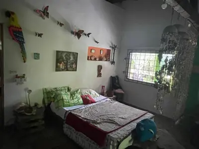 a bedroom with a bed in the corner of the room at Casa Santa María in El Porvenir