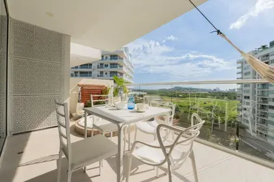 a white table and chairs on a balcony with a view at MQ1003 | Jacuzzi privado · Relax en Cielo Mar in Cartagena de Indias