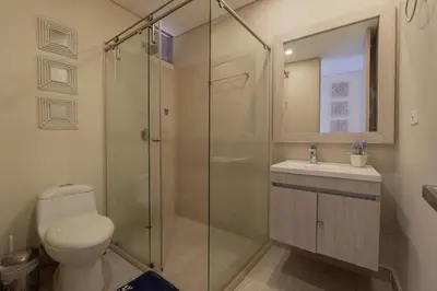 a bathroom with a shower and a toilet and a sink at MQ1206 | Lujo, vista y jacuzzi privado 2BD in Cartagena de Indias