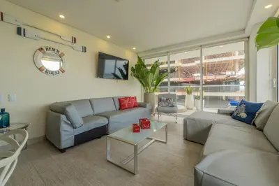 a living room with a couch and a table at MQ1206 | Lujo, vista y jacuzzi privado 2BD in Cartagena de Indias