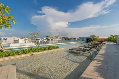 a row of benches on the roof of a building at MQ1206 | Lujo, vista y jacuzzi privado 2BD in Cartagena de Indias