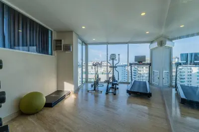 a gym with two exercise bikes in a room with windows at MQ701 Nuevo Apto Boho Style Jacuzzi privado in Cartagena de Indias