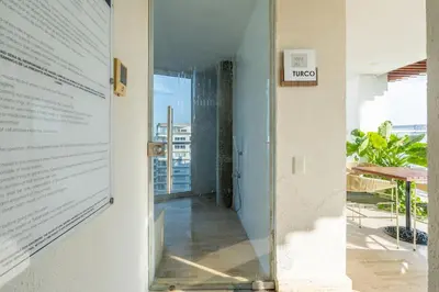 a glass door leading to a hallway with a view at MQ701 Nuevo Apto Boho Style Jacuzzi privado in Cartagena de Indias