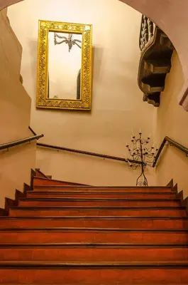 a stairway with a mirror on the wall at Hotel Boutique Casa Córdoba Estrella in Cartagena de Indias