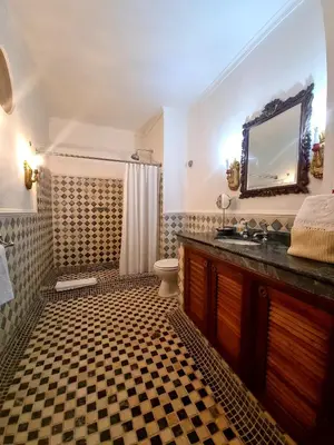 a bathroom with a sink and a toilet and a mirror at Hotel Boutique Casa Córdoba Estrella in Cartagena de Indias
