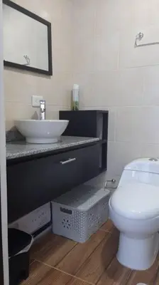 a bathroom with a white toilet and a sink at Apto en Coveñas cerca al mar in Coveñas