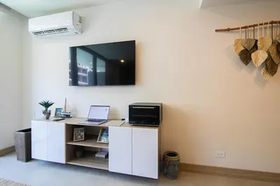 a room with a white desk with a computer on it at Apartamento en Condominio con acceso directo al mar en Cartagena in Cartagena de Indias