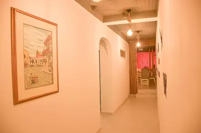 a hallway with a painting on the wall at Casa Acogedora con Piscina - House Rouse 14 in Cartagena de Indias