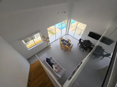 an overhead view of a living room and dining room at Dúplex de lujo con vista al mar - San Bernardo del Viento in San Bernardo del Viento