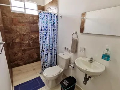 a bathroom with a toilet and a sink at Dúplex de lujo con vista al mar - San Bernardo del Viento in San Bernardo del Viento
