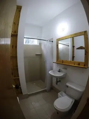 a bathroom with a toilet and a shower and a sink at Apartamento frente al mar mejor playa en Coveñas in Coveñas