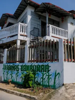 a house with graffiti on the side of it at Cabañas en San Antero Bambumar2 in San Antero