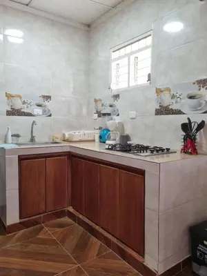 a kitchen with a sink and a stove in it at Cabaña Amadeus cerca al mar in Coveñas
