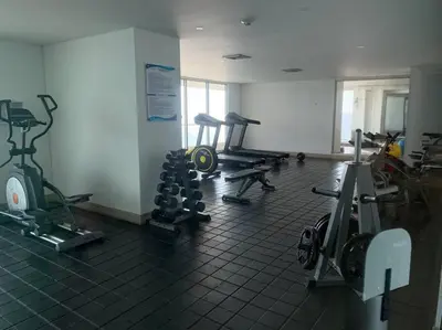 a gym with several treadmills and machines in a room at Sea, Sand & Skyline 30th-Floor Poolside Getaway in Cartagena de Indias